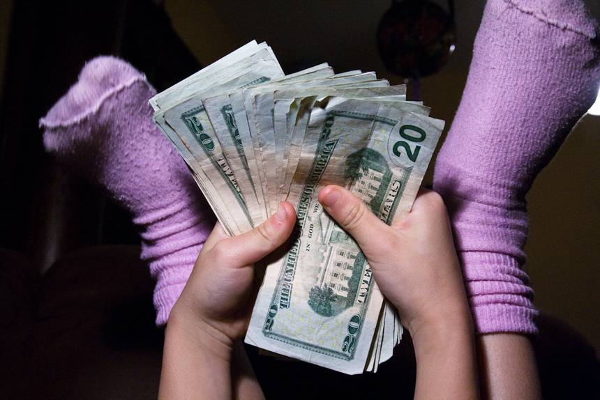 kid_holding_money_jpg_860x0_q70_crop-scale.jpg